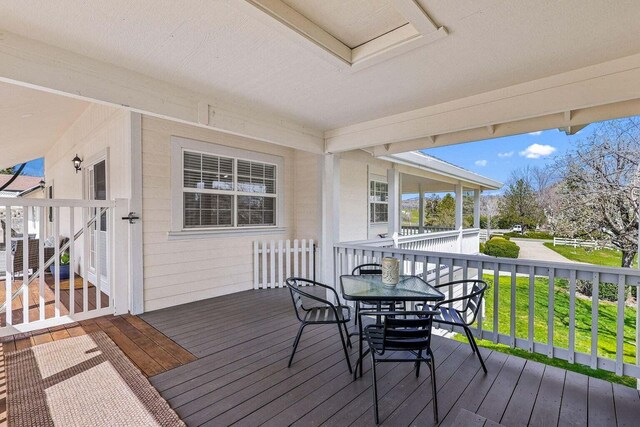 deck featuring a lawn