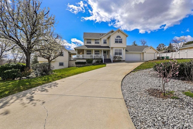 view of front of property featuring a garage and a front yard