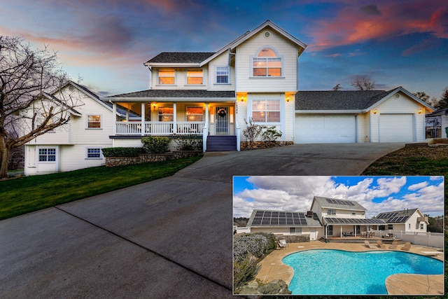 view of front of home with a fenced in pool, a lawn, a garage, and a porch