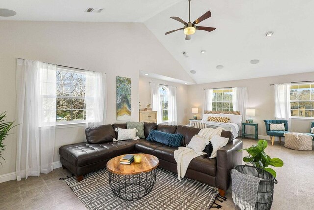 living room featuring ceiling fan and high vaulted ceiling