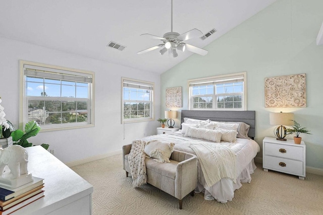 carpeted bedroom featuring high vaulted ceiling and ceiling fan