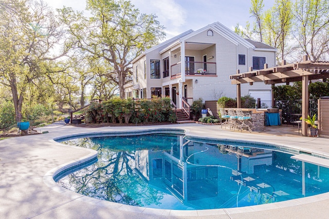 view of pool with a pergola and a patio area