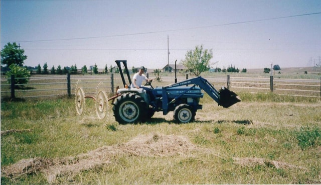 view of yard with a rural view