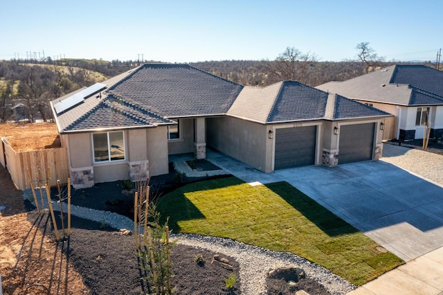 ranch-style house with a garage and a front yard