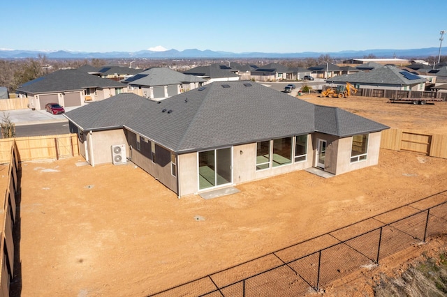 rear view of property featuring a patio and a mountain view