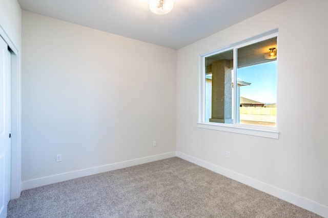 empty room with light colored carpet