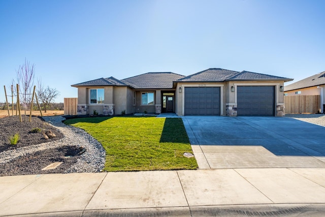 view of front of house featuring a garage and a front yard