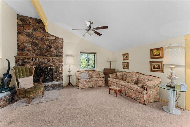 living room featuring carpet flooring, ceiling fan, a fireplace, and vaulted ceiling