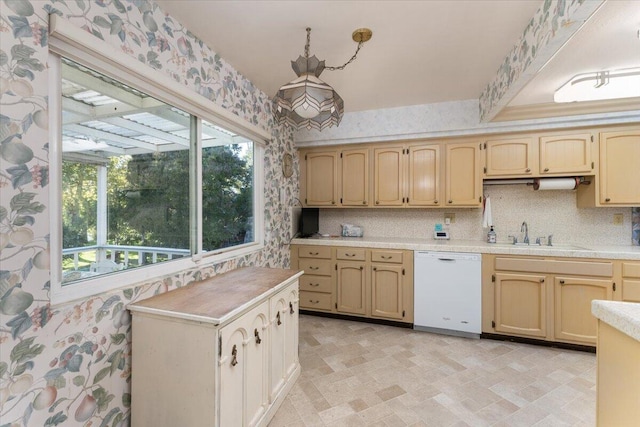 kitchen with plenty of natural light, dishwasher, and sink