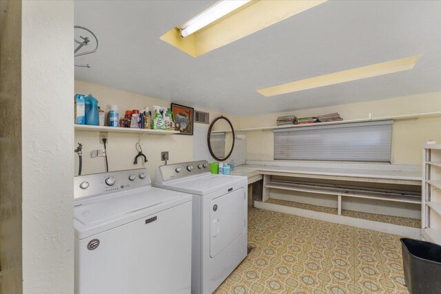 laundry area with separate washer and dryer