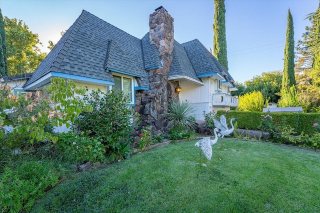 rear view of property with a yard