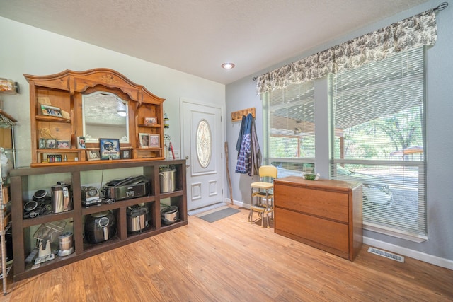 interior space with hardwood / wood-style flooring