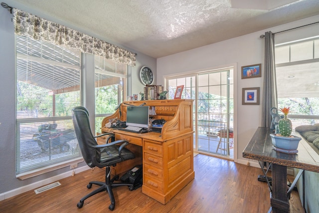 office area featuring a textured ceiling and hardwood / wood-style floors