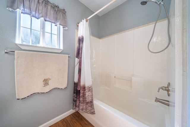 bathroom featuring shower / bathtub combination with curtain and wood-type flooring