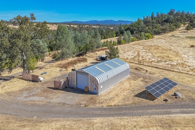 birds eye view of property with a mountain view