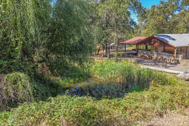 view of yard with a gazebo and a water view