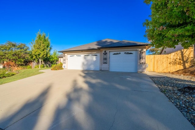 view of side of property with a garage