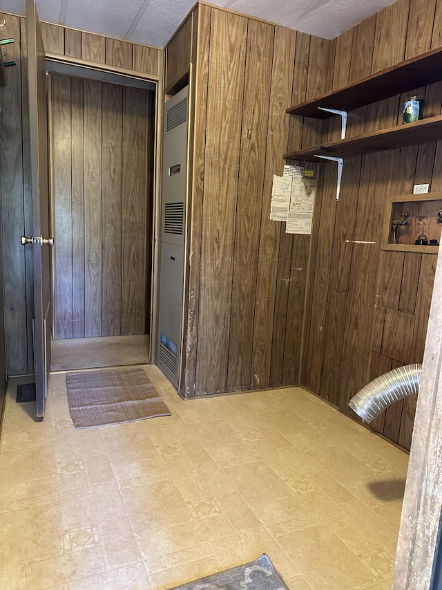 mudroom with wooden walls