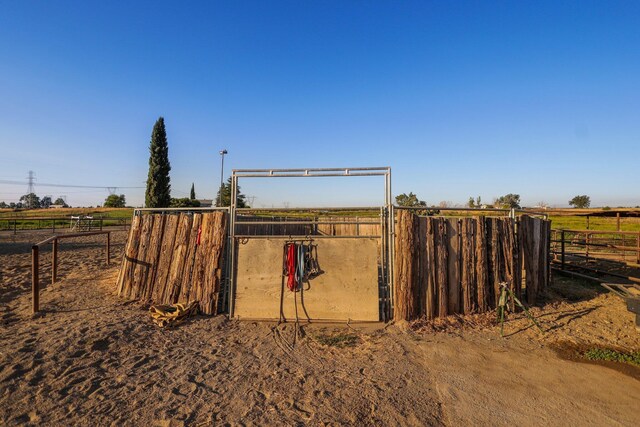 view of outbuilding with a rural view