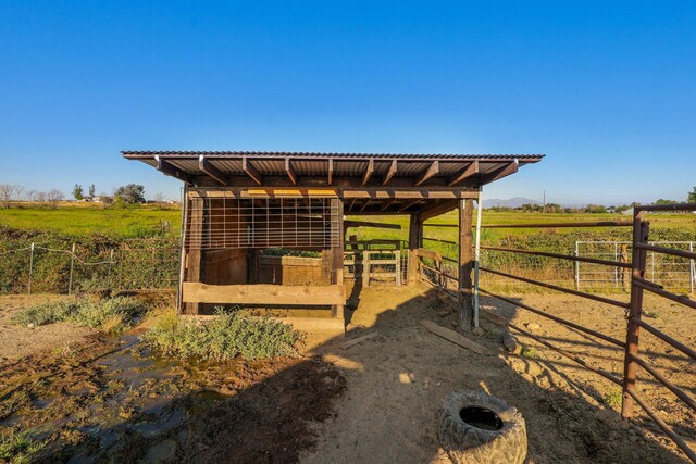 view of outbuilding featuring a rural view