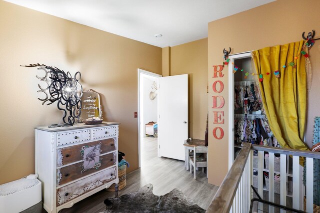 bedroom featuring a closet and hardwood / wood-style flooring