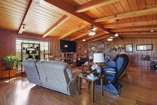 living room with ceiling fan, a wealth of natural light, and wooden ceiling