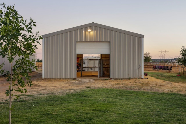 view of outbuilding with a yard