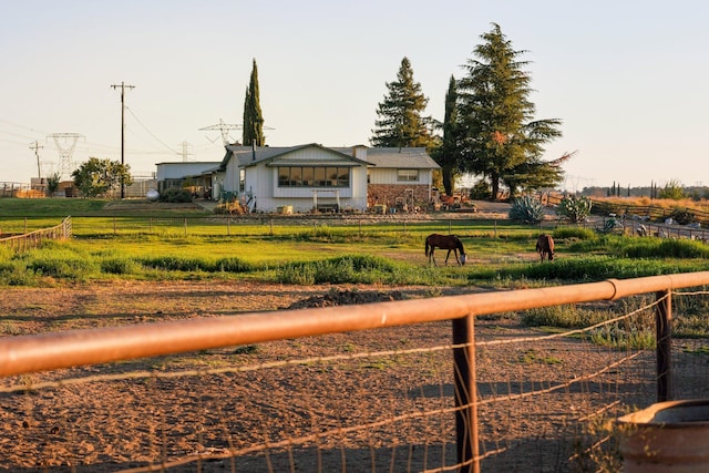 view of yard with a rural view