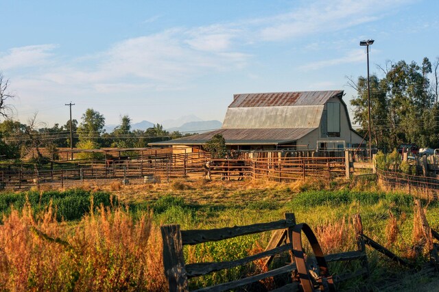 exterior space with an outbuilding and a rural view