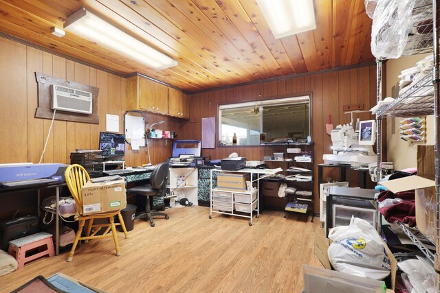 home office with light hardwood / wood-style flooring, a wall unit AC, wooden walls, and wooden ceiling