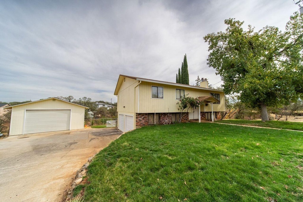 view of front of house with a front yard and a garage