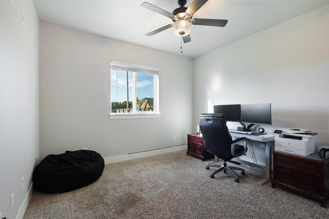 carpeted home office featuring ceiling fan