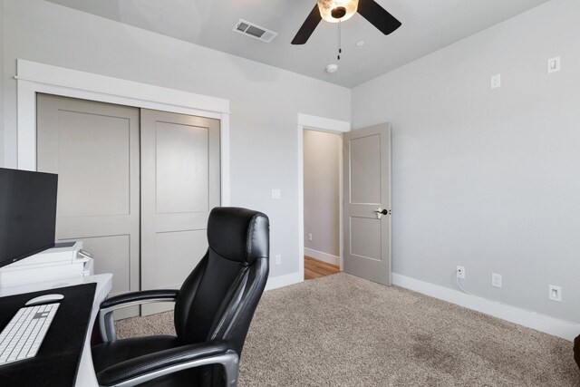 office area with light carpet and ceiling fan