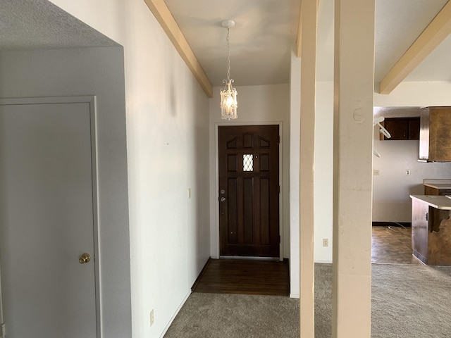 interior space with a notable chandelier and carpet floors