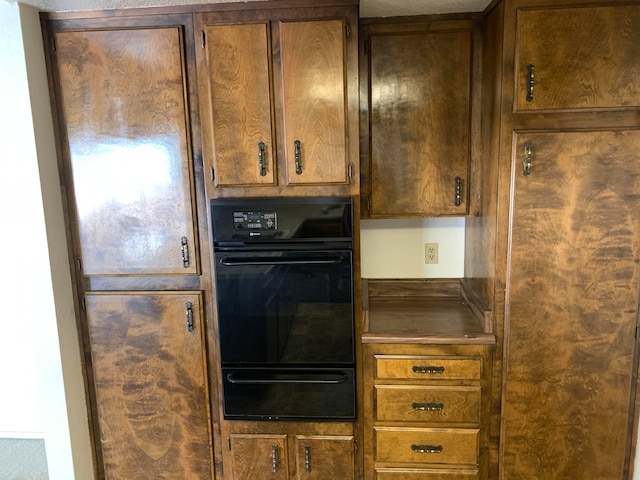 kitchen with black double oven