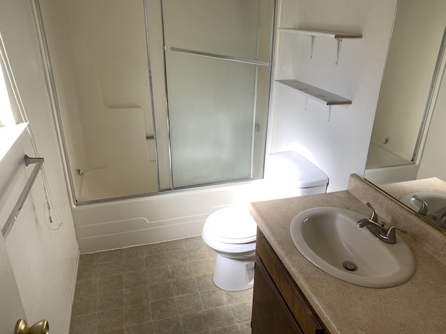 full bathroom with combined bath / shower with glass door, toilet, and vanity