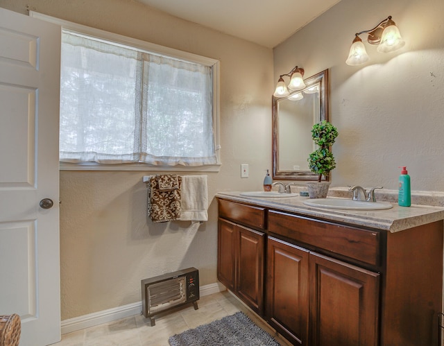 bathroom with tile patterned flooring and vanity