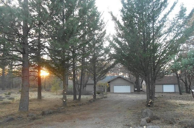 view of property hidden behind natural elements