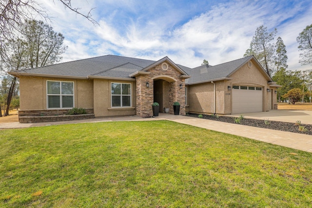 view of front of home with a front yard and a garage