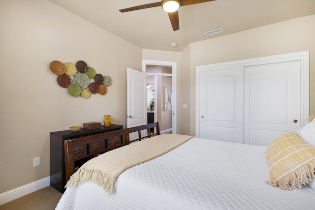 carpeted bedroom with a closet and ceiling fan