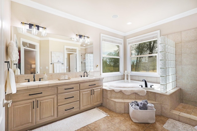 bathroom with vanity, ornamental molding, and tile patterned flooring