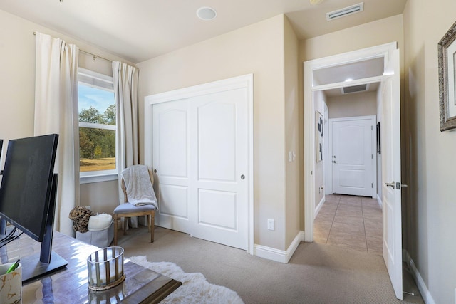 living area with light carpet