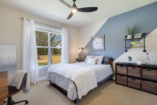 bedroom with light carpet and ceiling fan