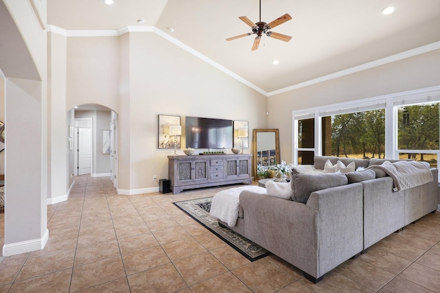 living room with crown molding, ceiling fan, high vaulted ceiling, and light tile patterned floors