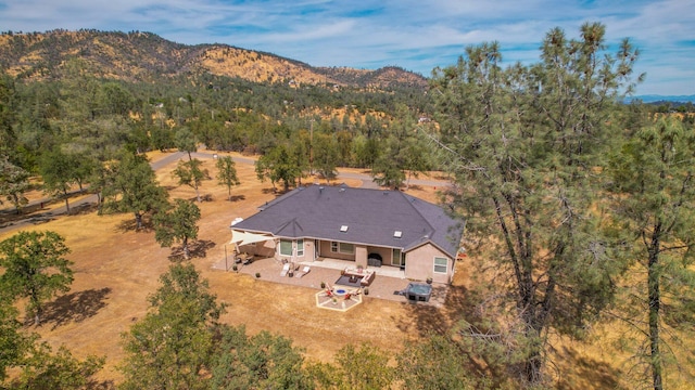 birds eye view of property featuring a mountain view