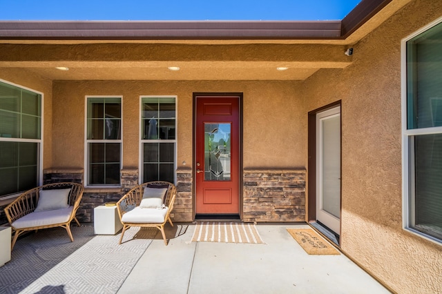 doorway to property with a patio area