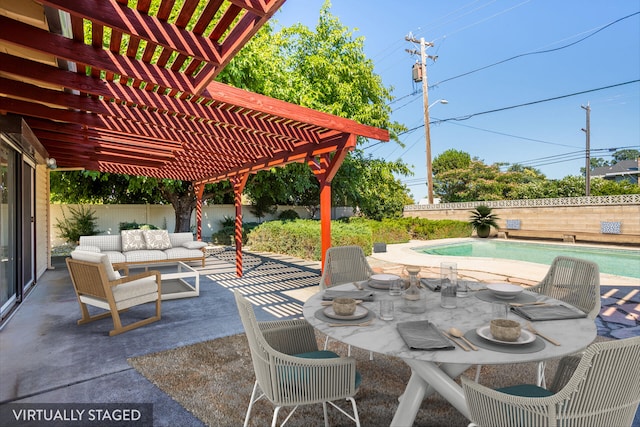 view of patio / terrace featuring a fenced in pool, a pergola, and outdoor lounge area