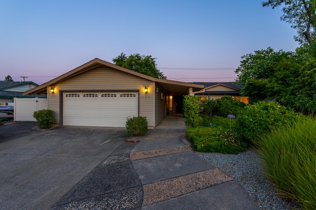 ranch-style house featuring a garage