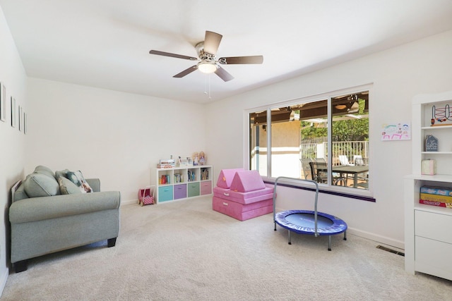 playroom featuring carpet and ceiling fan