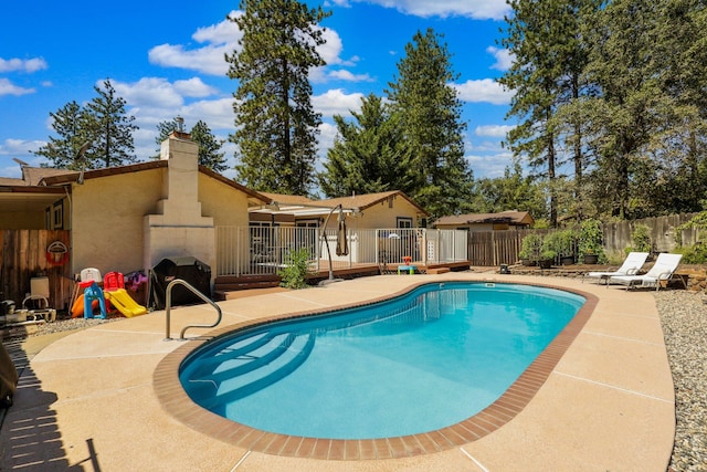 view of swimming pool with a patio area